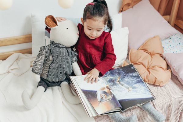 reading to stuffed animals for fun stay at home activities for kids