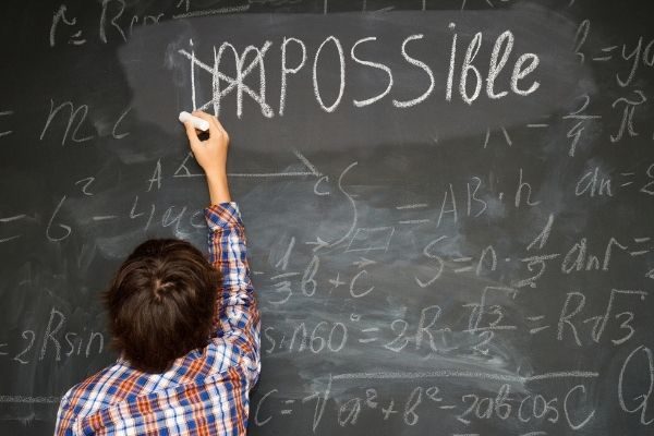boy writing impossible: quotes on facing challenges