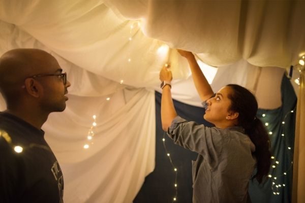 build a blanket fort for cheap and easy at home Valentine's Day ideas for couples