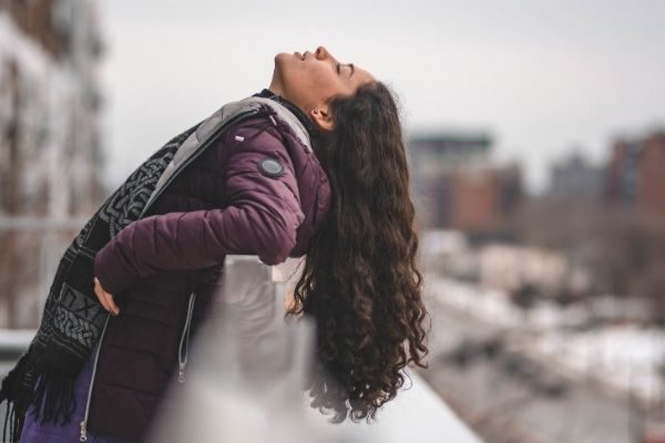 Woman on a ledge, don't give up short quotes about growth mindset