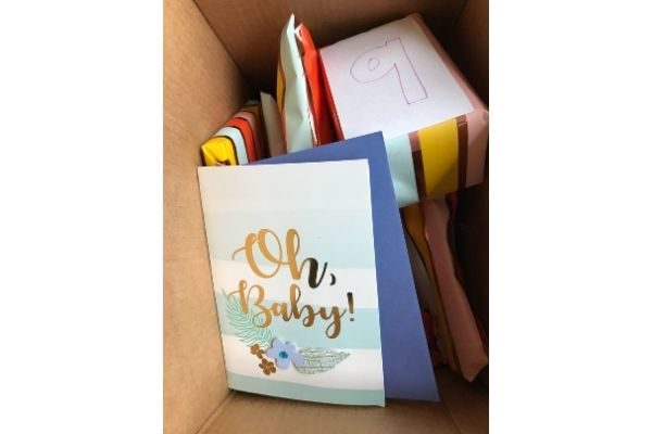 A card at the top of the new mommy care package