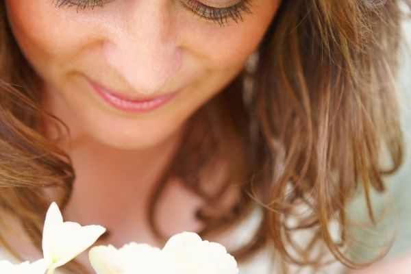 simple life pleasures found in nature, woman with flowers