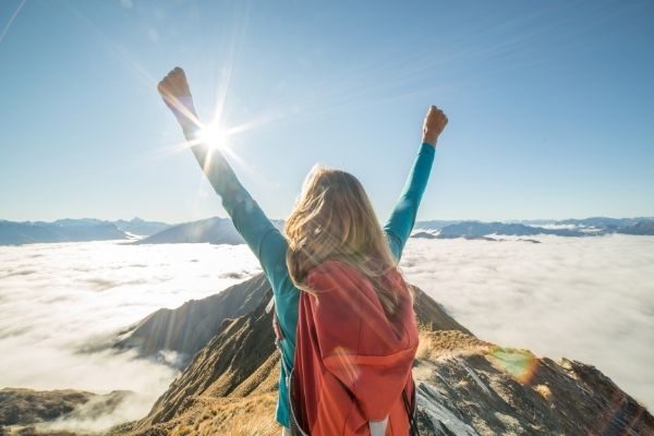 hard times make for deep things to talk about: woman with hands in air