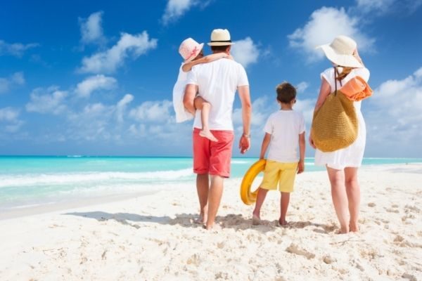 family travel at the beach