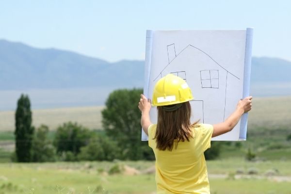Inspirational and motivational thought of the day ideas for kids: girl holding house and wearing hard hat