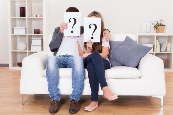simple and tricky yes or no questions for couples sitting on a couch