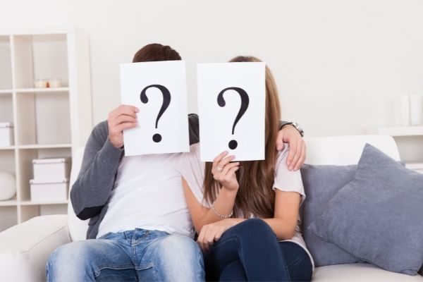 This or that couples questions that are flirty and dirty: couple sitting on a couch
