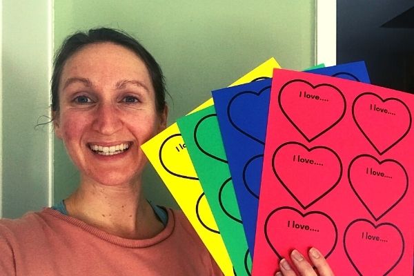 Jenn holding up the blank hearts templates printables