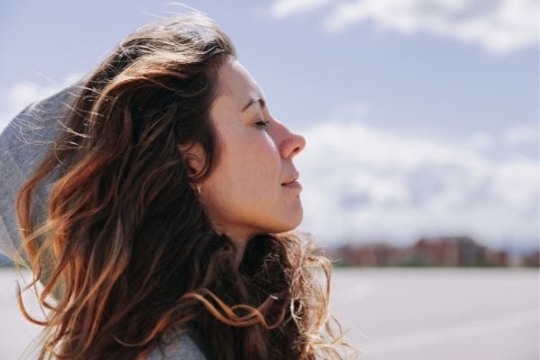 woman on the beach breathing in, youtube video