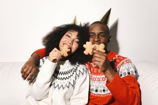couple eating holiday cookies