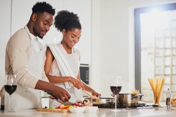 couple cooking together; date night ideas for married couples at home