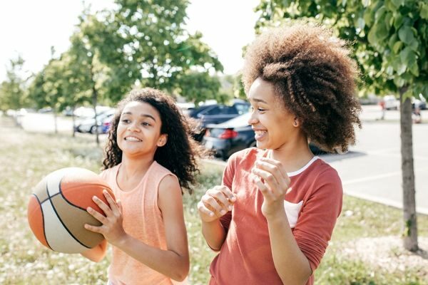 two girls playing basketball; sports quiz