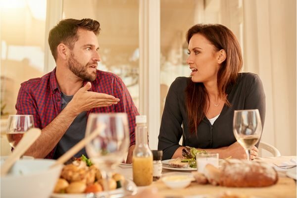 couples talking at dinner table; fun debate topics