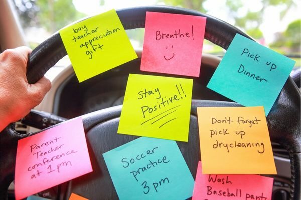 steering wheel with a sticky notes of things to do; motherhood burnout