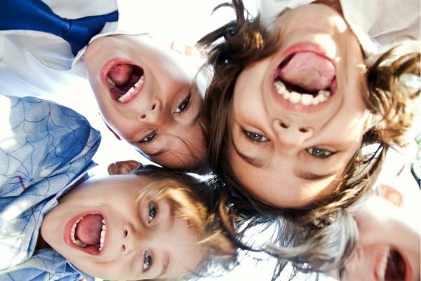 four kids faces being goofy; tongue twister activities
