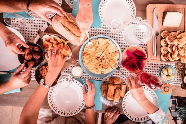 people eating food on a table