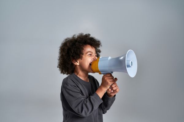 boy talking in a megaphone