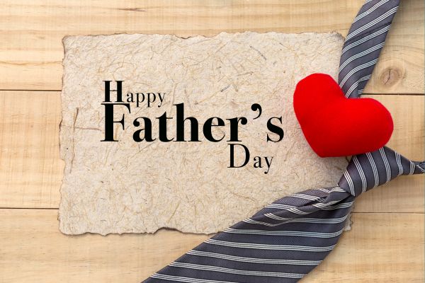 Happy Father's Day sign with a ties and a heart