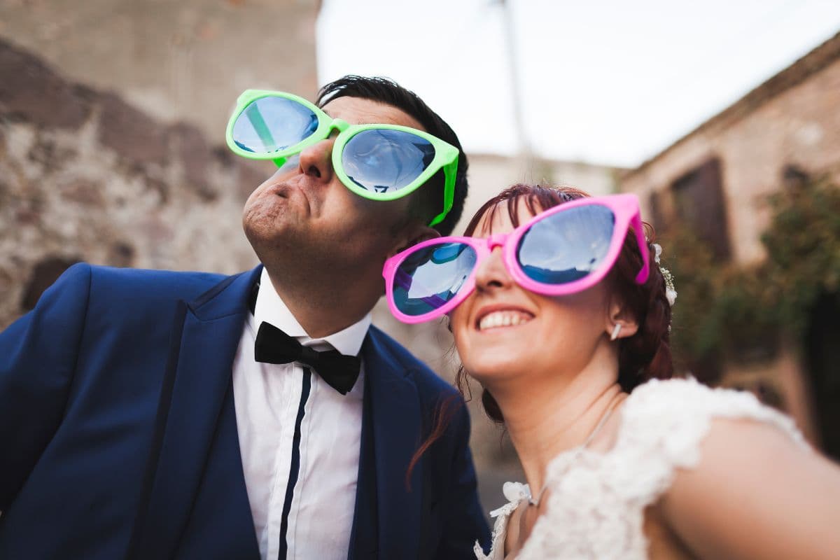 couple wearing funny glasses; embarrassing truth questions for Mr and Mrs