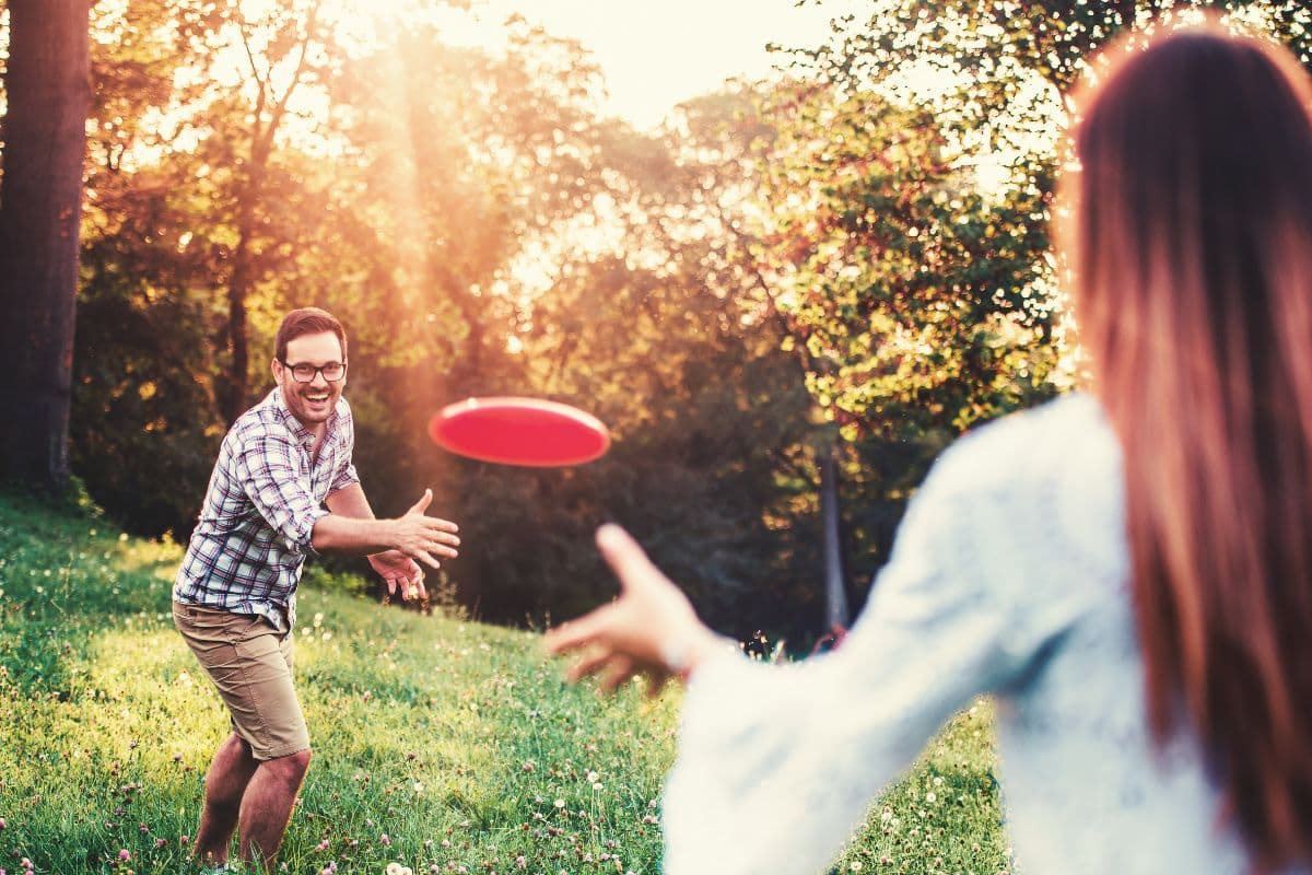 playing frisbee; picnic games for couples; family