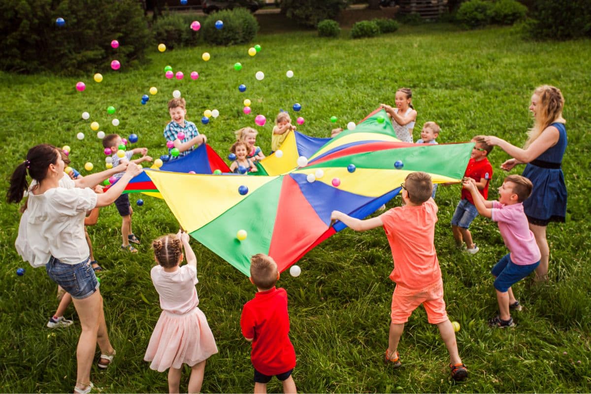 parachute outdoor team building activities and games for kids; preschoolers; elementary students