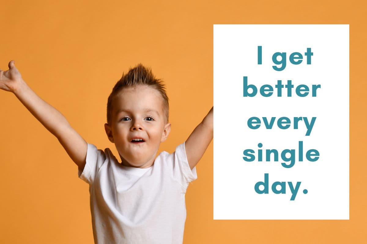 boy with hands in the air; positive affirmations for motivation; students