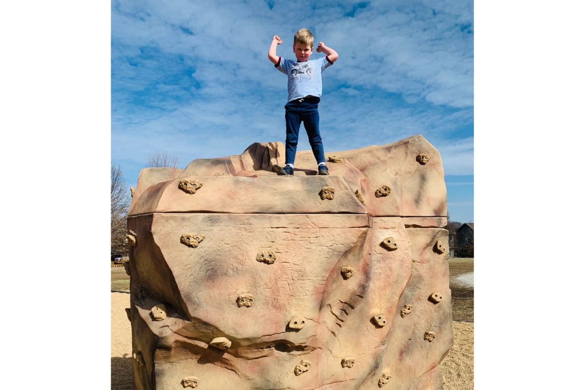 child on rock wall; stay active good habits for kids and students