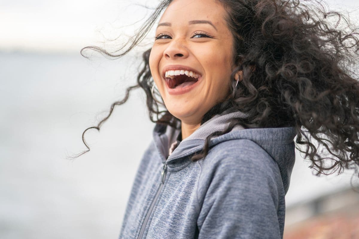 woman laughing, facts and benefits of laughter