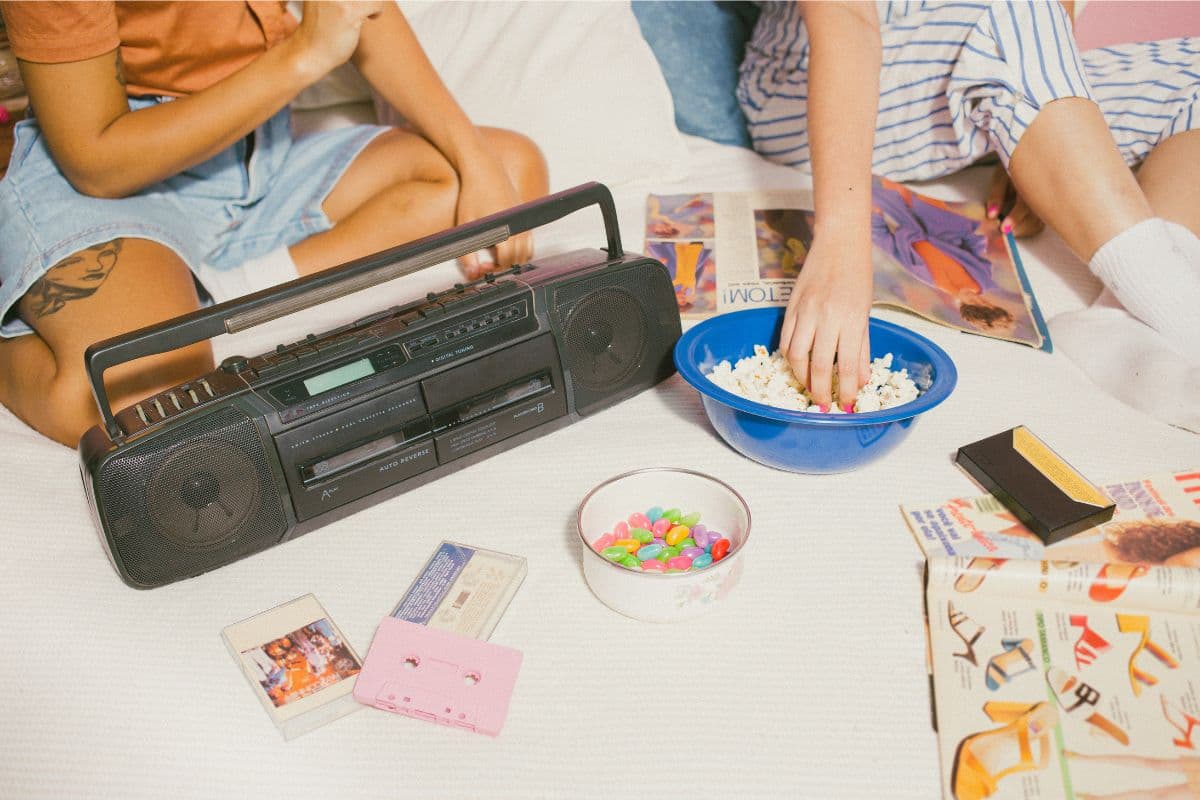 people eating snacks and listening to a boom box