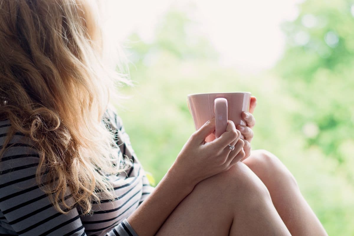 woman sitting with coffee