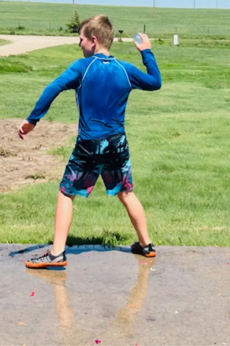 boy throwing balloon