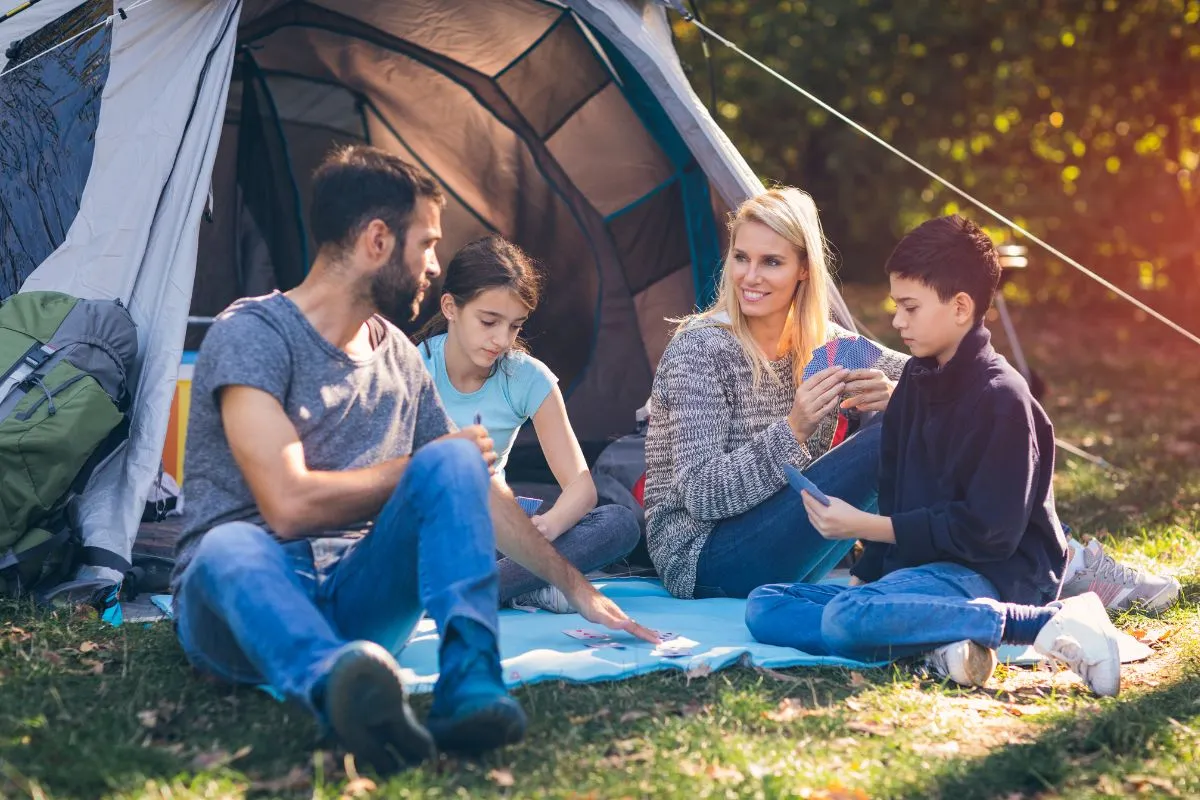 family playing camping card games for kids 