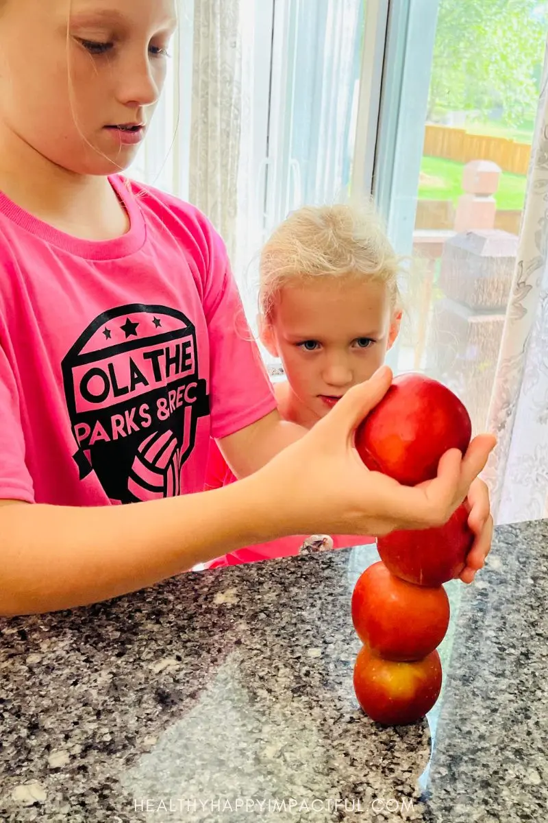 stack the apples Thanksgiving minute-to-win-it for kids