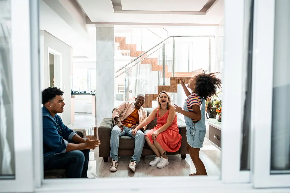 child acting out, adults laughing