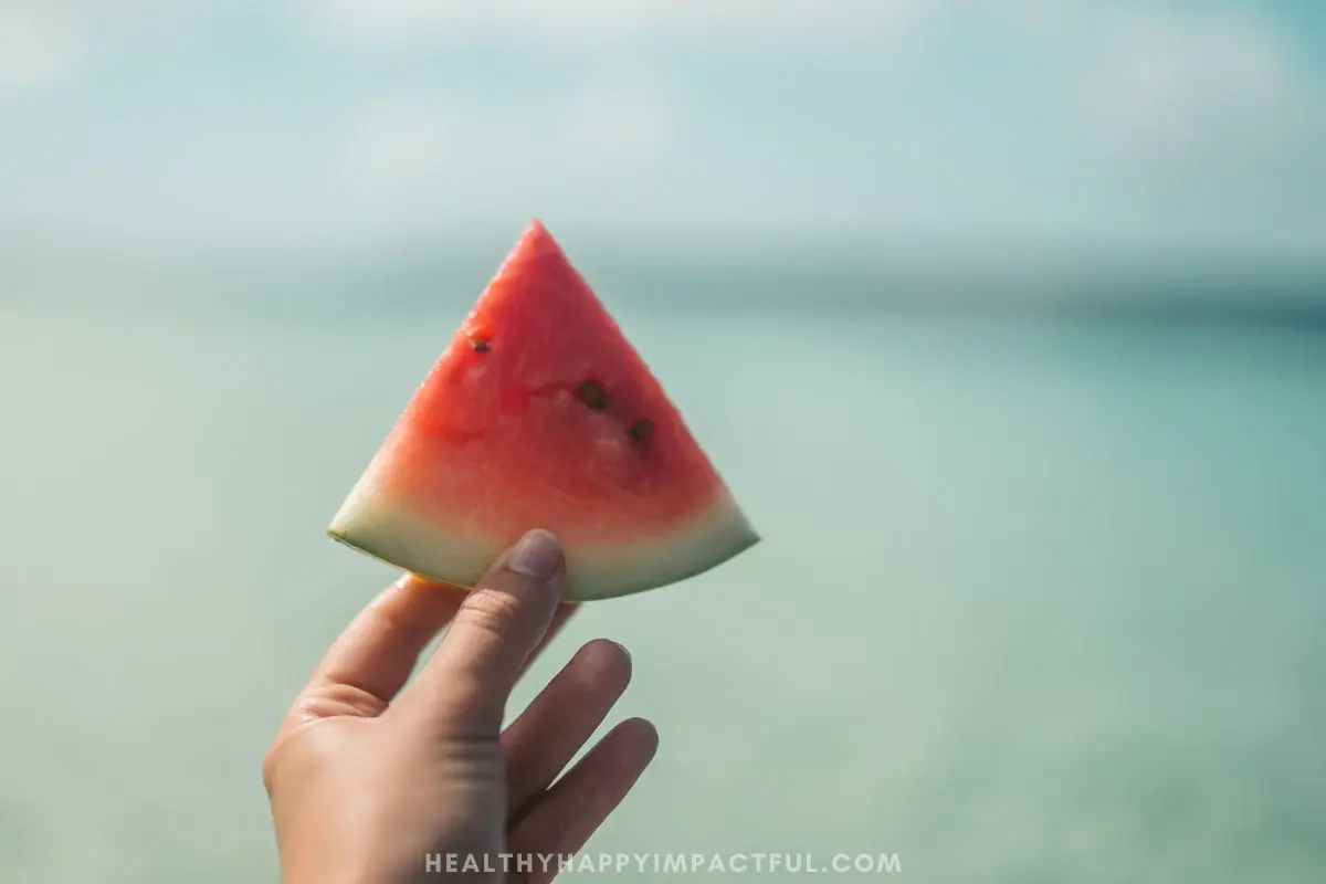picture of someone holding a watermelon