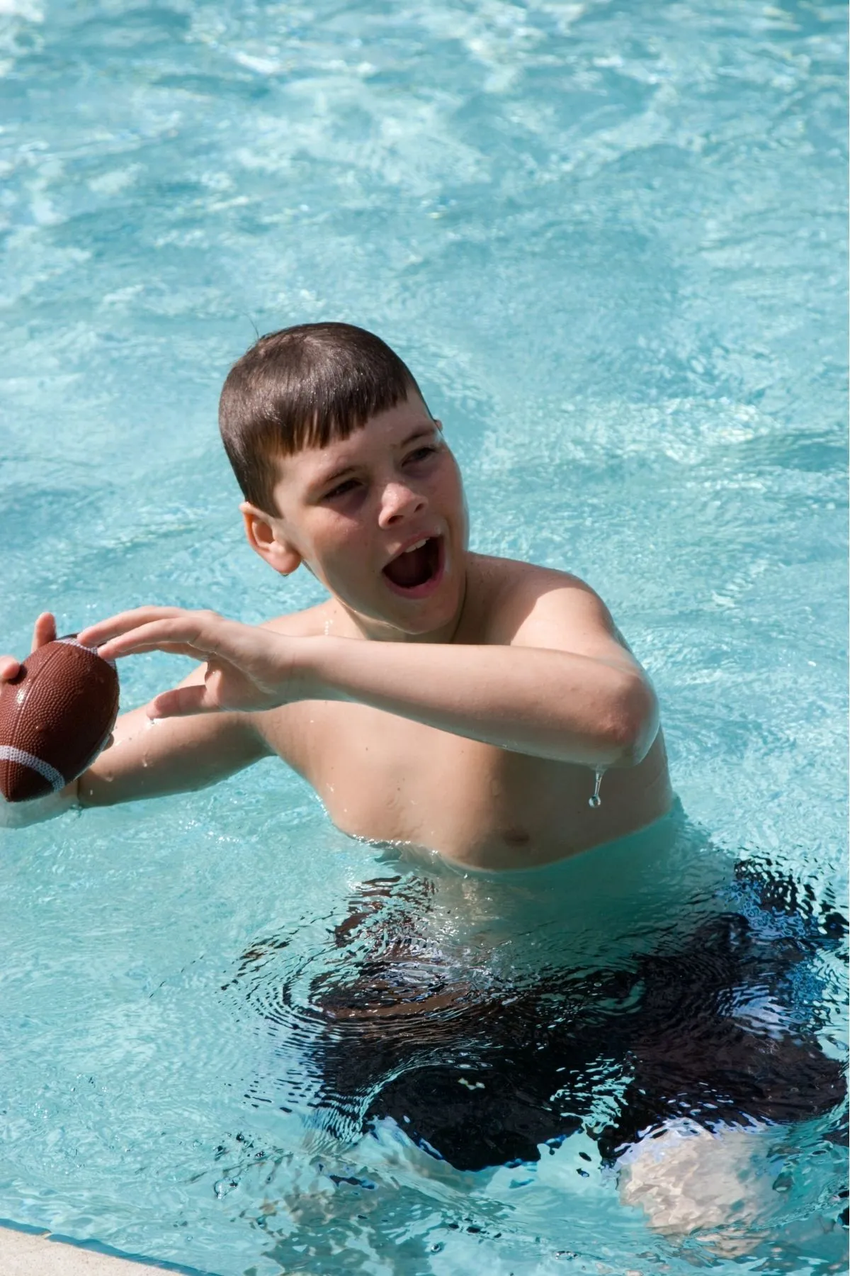 playing football while swimming